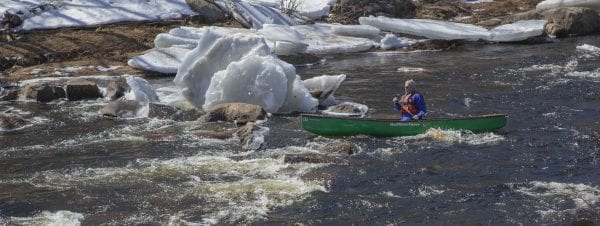 Marty Plante runs the Cedar River in early April, when conditions were still winterlike. Photo by Mike Lynch