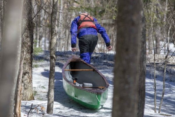 Marty Plante runs the Cedar River in early April, when conditions were still winterlike. Photo by Mike Lynch