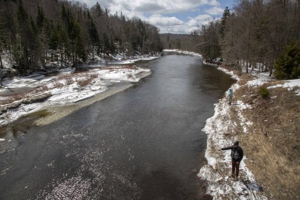 A man fishes in open water on the West Branch of the Ausable River April 1. Photo by Mike Lynch