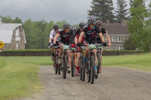 Cyclists compete in the 100-kilometer Wilmington Whiteface mountain bike race that takes place every June. Photo by Mike Lynch