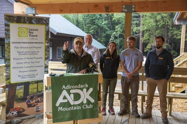 Adirondack Mountain Club executive director Neil Woodworth talks at the High Peaks Information Center during the kickoff of the Leave No Trace Hot Spot week in August. LNT principles were the topic of activities during the Hot Spot period. Photo by Mike Lynch