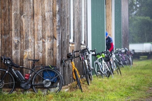 Cyclists lean their bikes against a barn at Reber Rock Farm in August. Photo by Mike Lynch