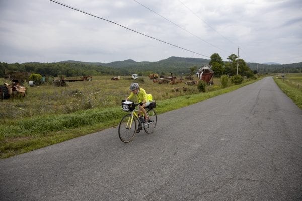 A Cycle Adirondacks participant rides through farmlands in the Champlain Valley. Photo by Mike Lynch