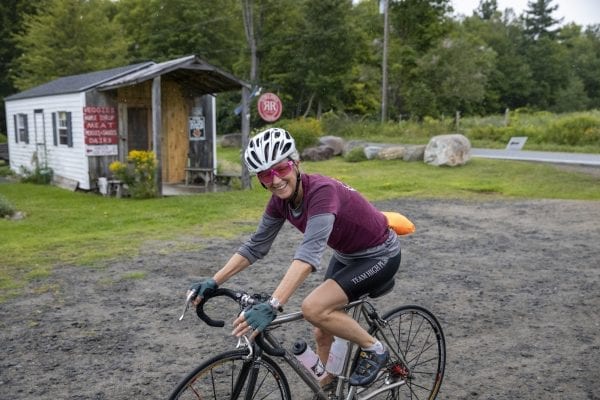 A Cycle Adirondacks participant enters Reber Rock Farm for a scheduled lunch break. Photo by Mike Lynch