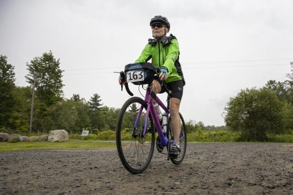 A Cycle Adirondacks participant enters Reber Rock Farm for a scheduled lunch break. Photo by Mike Lynch