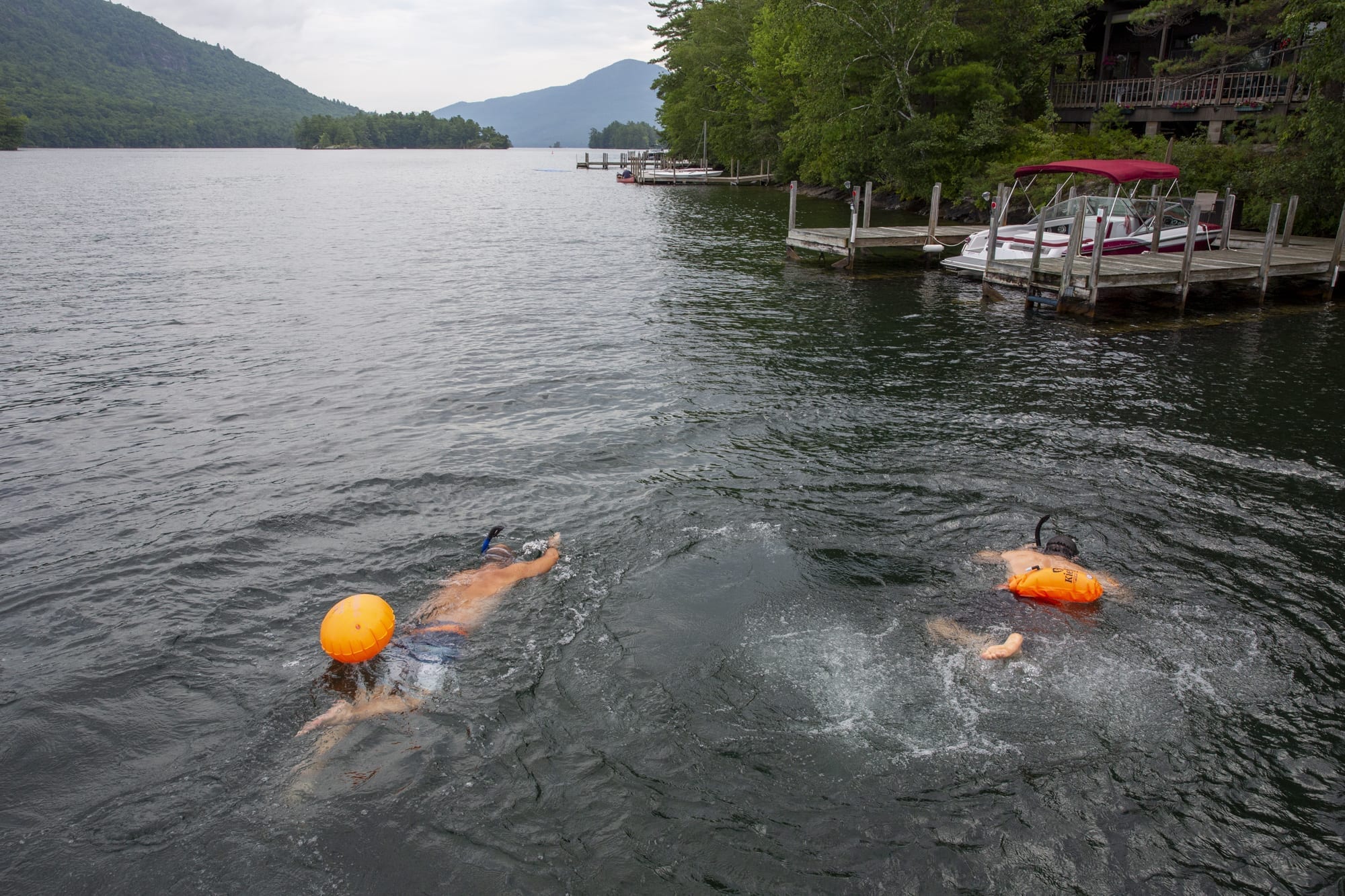 David Wick and Joe Thouin of the Lake George Park Commission look for milfoil in Lake George, which has been under debate by the APA