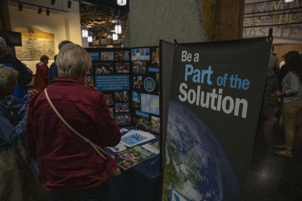Students set up displays in the lobby at The Wild Center for the event. Photo by Mike Lynch