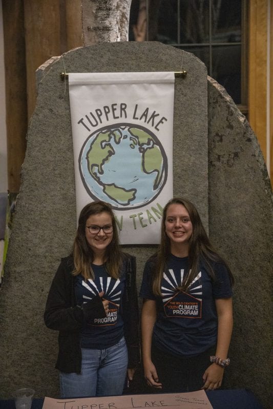 Students set up displays in the lobby at The Wild Center for the event. Photo by Mike Lynch