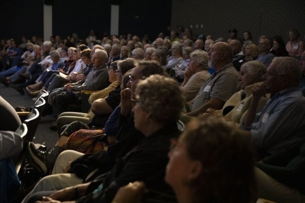 A large crowd listens to the talk by Bill McKibben. Photo by Mike Lynch
