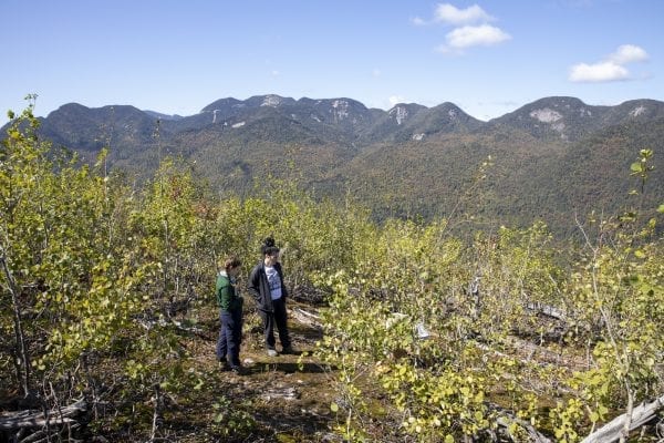SUNY Plattsburgh Professor Mark Lesser and his students visited the 1999 Noonmark Fire site in September. Photo by Mike Lynch