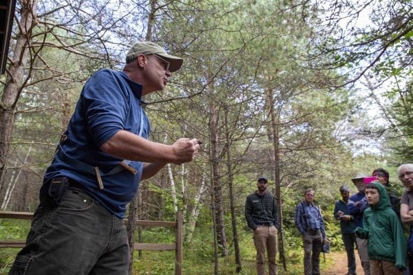 Eric Lind, director of community services and restoration for the New York state chapter of the Audobon Society, led a bird banding demonstration at The Wild Center in mid-August. Photo by Mike Lynch