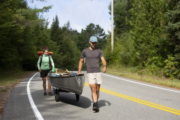 Olivier Van Herck and Zoë Agasi portage between Franklin Falls Pond and Union Falls Pond in August. Photo by Mike Lynch