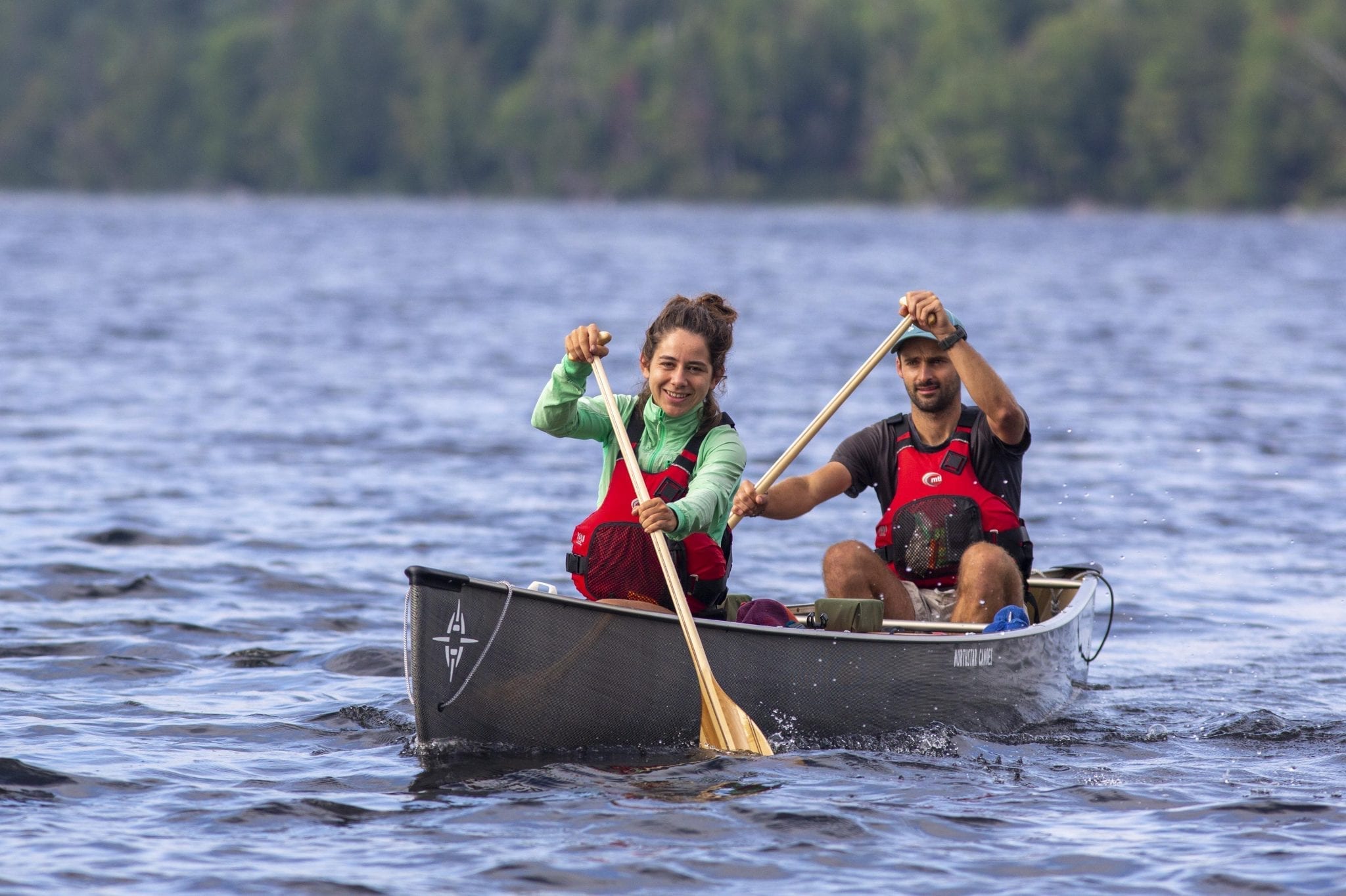 couple paddling a canoe along the Northern Forest Canoe Trail