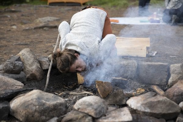 Zoë Agasi gets the campfire started. Photo by Mike Lynch