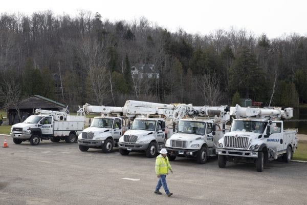 Utility trucks gather in the parking lot at Lake Colby Beach in Saranac Lake a few days after the Halloween storm. Photo by Mike Lynch