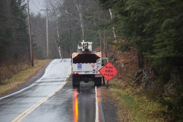 A utility crew works along South Shore Road around Lake Pleasant. Photo by Mike Lynch