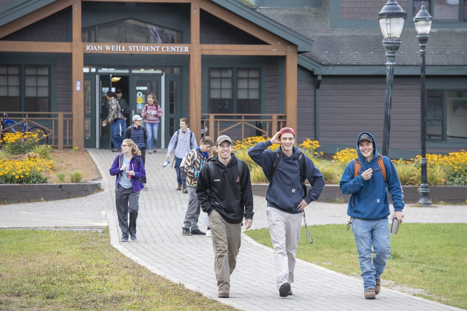 Students at Paul Smith's College stroll from campus building.