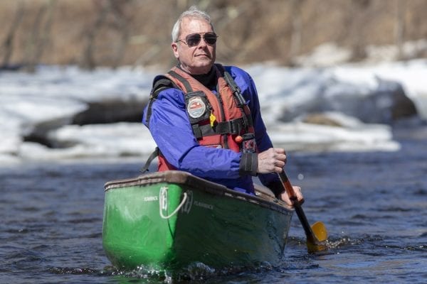 Marty Plante paddles the Cedar River in the central Adirondacks in early April. Photo by Mike Lynch