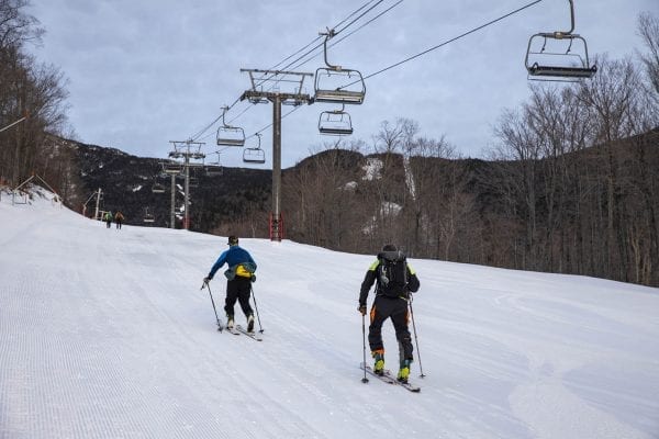Vinny McClelland, former owner of the Mountaineer, skins up Whiteface Mountain during a January morning. Photo by Mike Lynch
