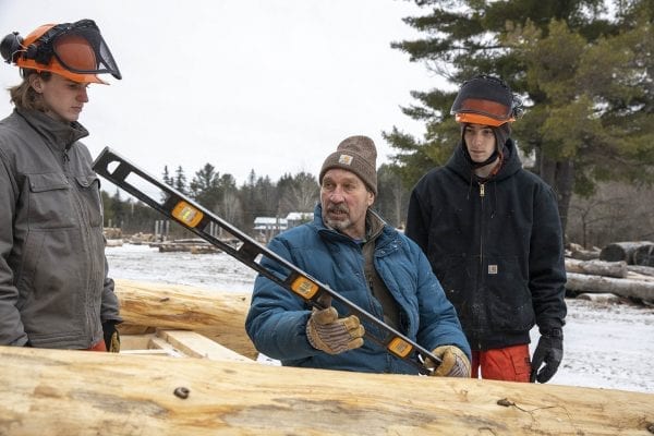 Bob Liseno teaches local students how to build a lean-to. Photo by Mike Lynch