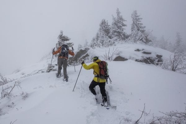 Phil Brown, left, and Tim Peartree summited Hurricane Mountain on February 11, 2020, skiing the lower elevations and snowshoeing the steeper upper section of the trail. They used the Hurricane Mountain Lane trailhead in Elizabethtown. Photo by Mike Lynch