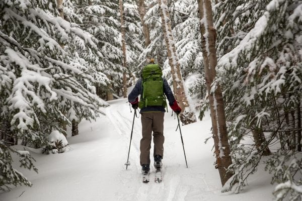 Ron Konowitz travels uphill with skis on Wright Peak in the High Peaks Wilderness. Photo by Mike Lynch