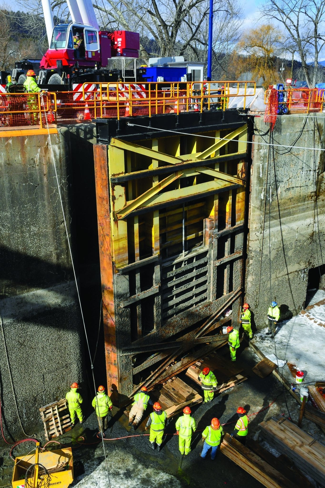 Canal employees work to level a miter gate on Lock 12 in the Champlain Canal. Photo by Cindy Schultz