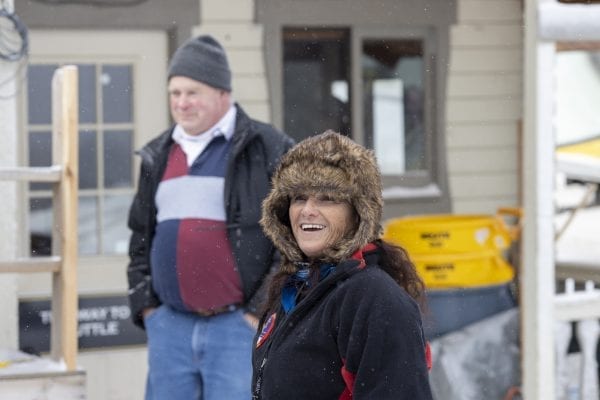 Luge official sports a grin during competition at Mount Van Hoevenberg in late February. Photo by Mike Lynch