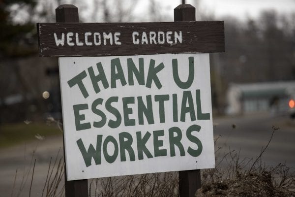 Signs like this one in Saranac Lake have been popping up throughout the Adirondacks. Photo by Mike Lynch