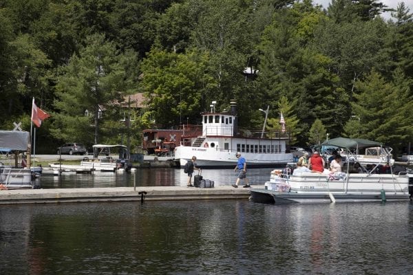 This photo gallery shows a sleepy but scenic Raquette Lake on a Friday afternoon. The quiet scene is a result of a slowdown in tourism due to the pandemic. Most years Friday afternoons in July in this tiny hamlet are much busier, with boats waiting for space on the bustling dock as vessels and visitors come and go. This gallery is part of "Snapshot," a multimedia series that captures a scene through photo galleries and videos. Photo by Mike Lynch