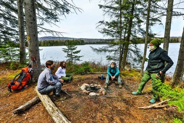 Betsy Kepes, husband Tom Vandewater, and young friends Amanda Oldacre and Jim Burdick hiked and backpacked the Cranberry 50 in the spring for an article Kepes wrote for the July issue. Photo by Nancie Battaglia