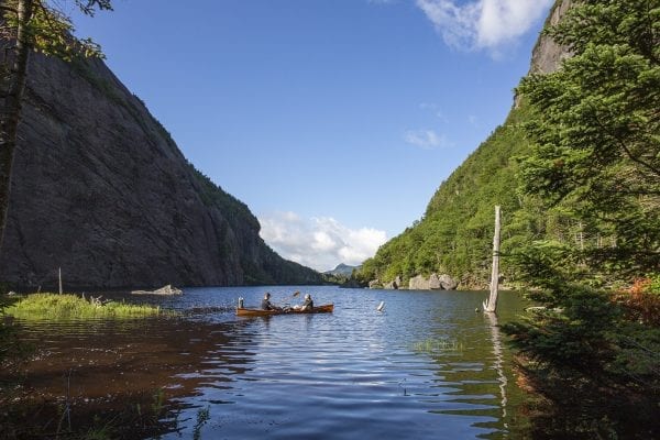 Question: What is the name of this popular high elevation lake? 
Answer: Avalanche Lake, which is located in the High Peaks Wilderness.
