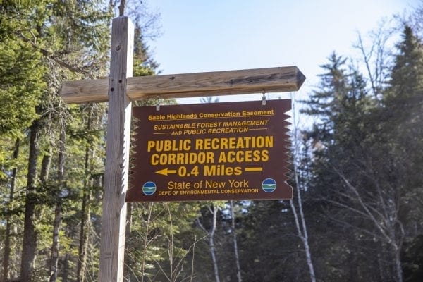In May, multimedia reporter Mike Lynch joined former Explorer editor Phil Brown for a trip on the Sable Highlands Easement for a biking and hiking trip. The excursion started at the Fishhole Pond parking area, near Loon Lake. From there, they biked north on the D&H Road for about 2 miles, then turned left onto an old logging road and biked that a few miles to its end in a clearing with views of Loon Lake Mountains, Peaked Mountain and the Plumadore Range. On the way back, they got off their bikes and bushwhacked to a lookout on an unnamed peak with great views of the Sable Highlands and many peaks in the distance. DEC’s plans call for creating a mountain-bike loop around the unnamed peak and a hiking trail to the lookout. Neither has been done. These photos by Lynch are from that trip.