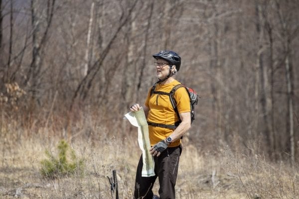In May, multimedia reporter Mike Lynch joined former Explorer editor Phil Brown for a trip on the Sable Highlands Easement for a biking and hiking trip. The excursion started at the Fishhole Pond parking area, near Loon Lake. From there, they biked north on the D&H Road for about 2 miles, then turned left onto an old logging road and biked that a few miles to its end in a clearing with views of Loon Lake Mountains, Peaked Mountain and the Plumadore Range. On the way back, they got off their bikes and bushwhacked to a lookout on an unnamed peak with great views of the Sable Highlands and many peaks in the distance. DEC’s plans call for creating a mountain-bike loop around the unnamed peak and a hiking trail to the lookout. Neither has been done. These photos by Lynch are from that trip.