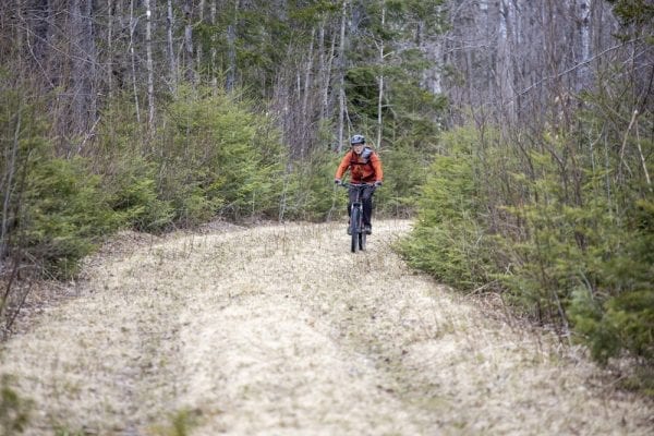 In May, multimedia reporter Mike Lynch joined former Explorer editor Phil Brown for a trip on the Sable Highlands Easement for a biking and hiking trip. The excursion started at the Fishhole Pond parking area, near Loon Lake. From there, they biked north on the D&H Road for about 2 miles, then turned left onto an old logging road and biked that a few miles to its end in a clearing with views of Loon Lake Mountains, Peaked Mountain and the Plumadore Range. On the way back, they got off their bikes and bushwhacked to a lookout on an unnamed peak with great views of the Sable Highlands and many peaks in the distance. DEC’s plans call for creating a mountain-bike loop around the unnamed peak and a hiking trail to the lookout. Neither has been done. These photos by Lynch are from that trip.