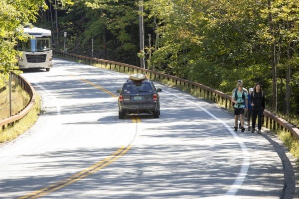Hikers walk along Route 73. Photo by Mike Lynch
