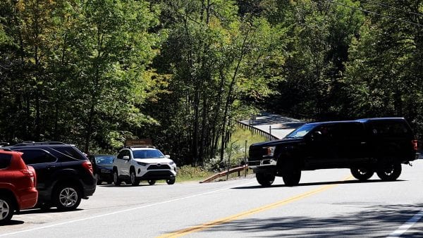 A truck backs onto Route 73 from the Giant Mountain parking lot. Photo by Mike Lynch