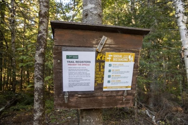 The state Department of Environmental Conservation encourages hikers to social distance at trail registers and while hiking. Photo by Mike Lynch