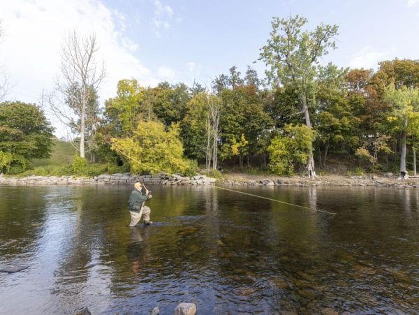 Fishing for salmon takes patience. Anglers can spend hours on the river without catching a fish. Photo by Mike Lynch