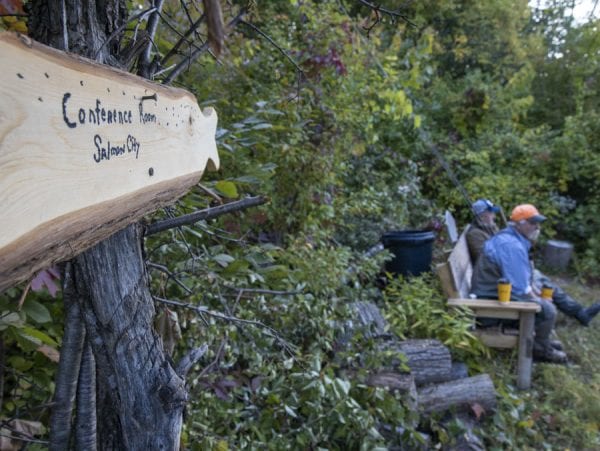 Anglers wait their turn on a bench in an area known as the Conference Room. Photo by Mike Lynch
