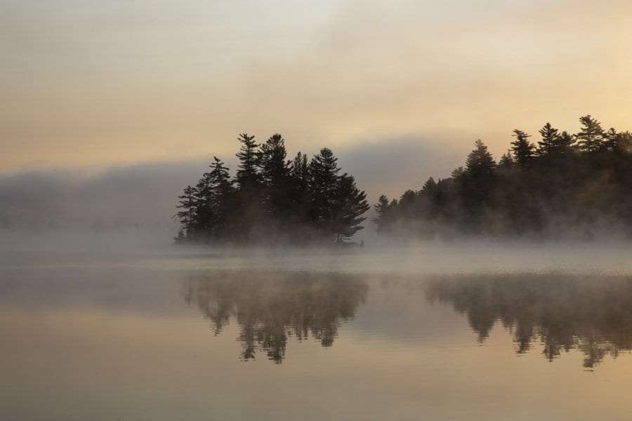 Franklin Falls Pond on the Saranac River, one of the rivers featured in the Salmon and Rivers series. Photo by Mike Lynch