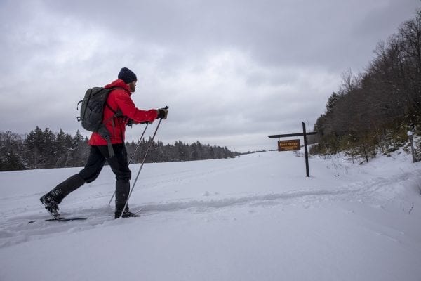 Evan Williams heads into the wooded section. Photo by Mike Lynch
