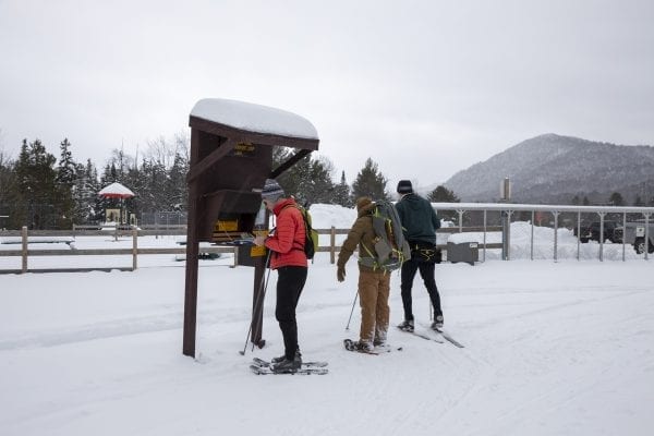 A crew signs in before heading off on the trail. Photo by Mike Lynch