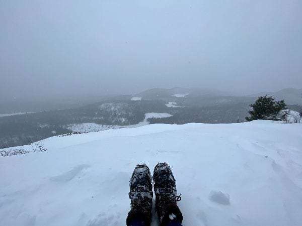 Boots with crampons on snow