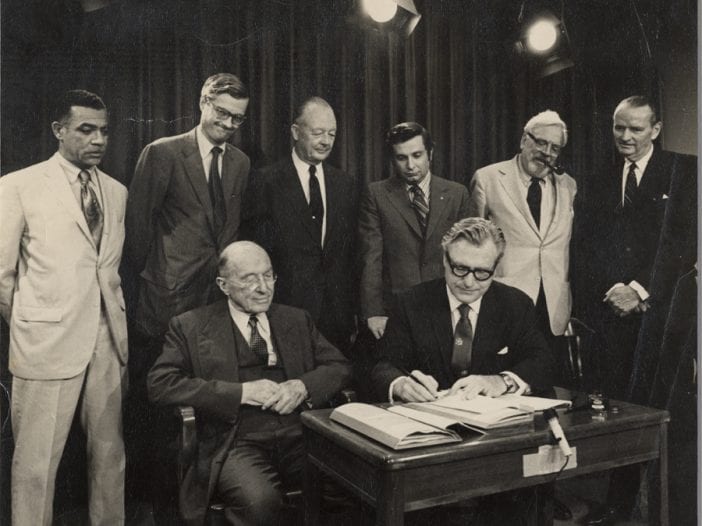 A photo of Gov. Nelson Rockefeller signing the Adirondack Park Agency Act