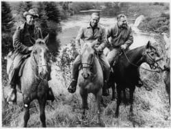 A picture of ranger Bill Petty guiding the Rockefeller brothers on horseback in the Adirondack High Peaks.
