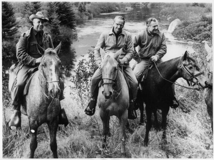 A picture of ranger Bill Petty guiding the Rockefeller brothers on horseback in the Adirondack High Peaks.