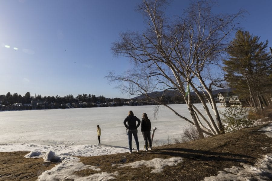 The ice-out watch on area lakes has begun with recent warm weather. Mirror Lake in Lake Placid was completely covered with ice on March 22, but should see some melting in the near future. Photo by Mike Lynch