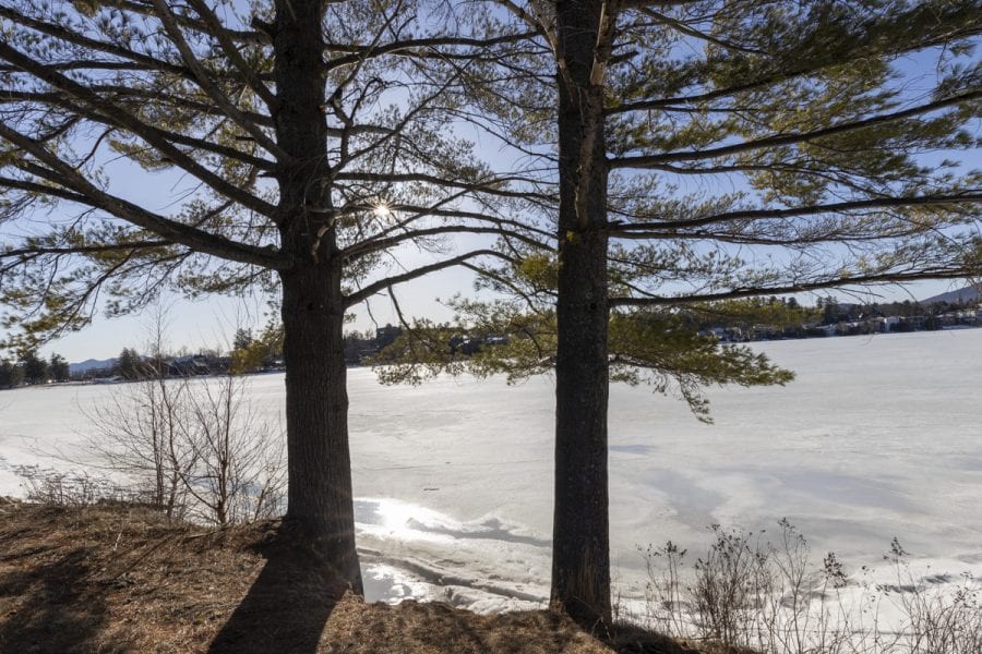 The ice-out watch on area lakes has begun with recent warm weather. Mirror Lake in Lake Placid was completely covered with ice on March 22, but should see some melting in the near future. Photo by Mike Lynch