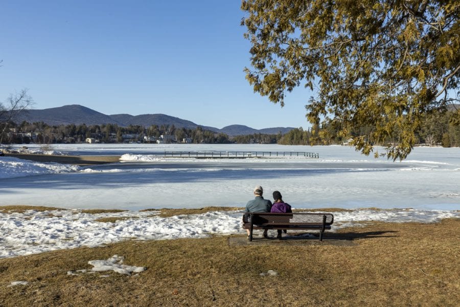 The ice out watch on area lakes has begun with recent warm weather. Mirror Lake in Lake Placid was completely covered with ice on March 22, but should see some melting in the near future. Photo by Mike Lynch
